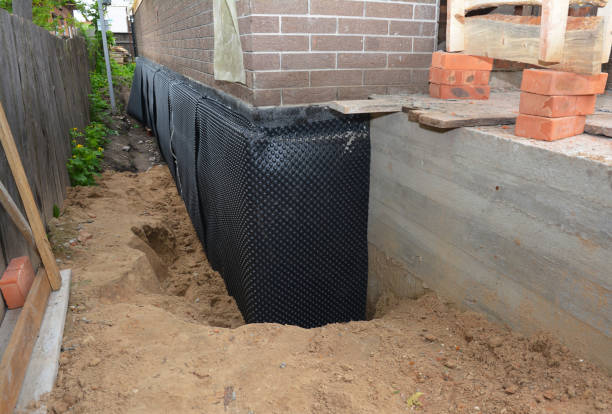 Happy homeowners after waterproofing job in Coleman